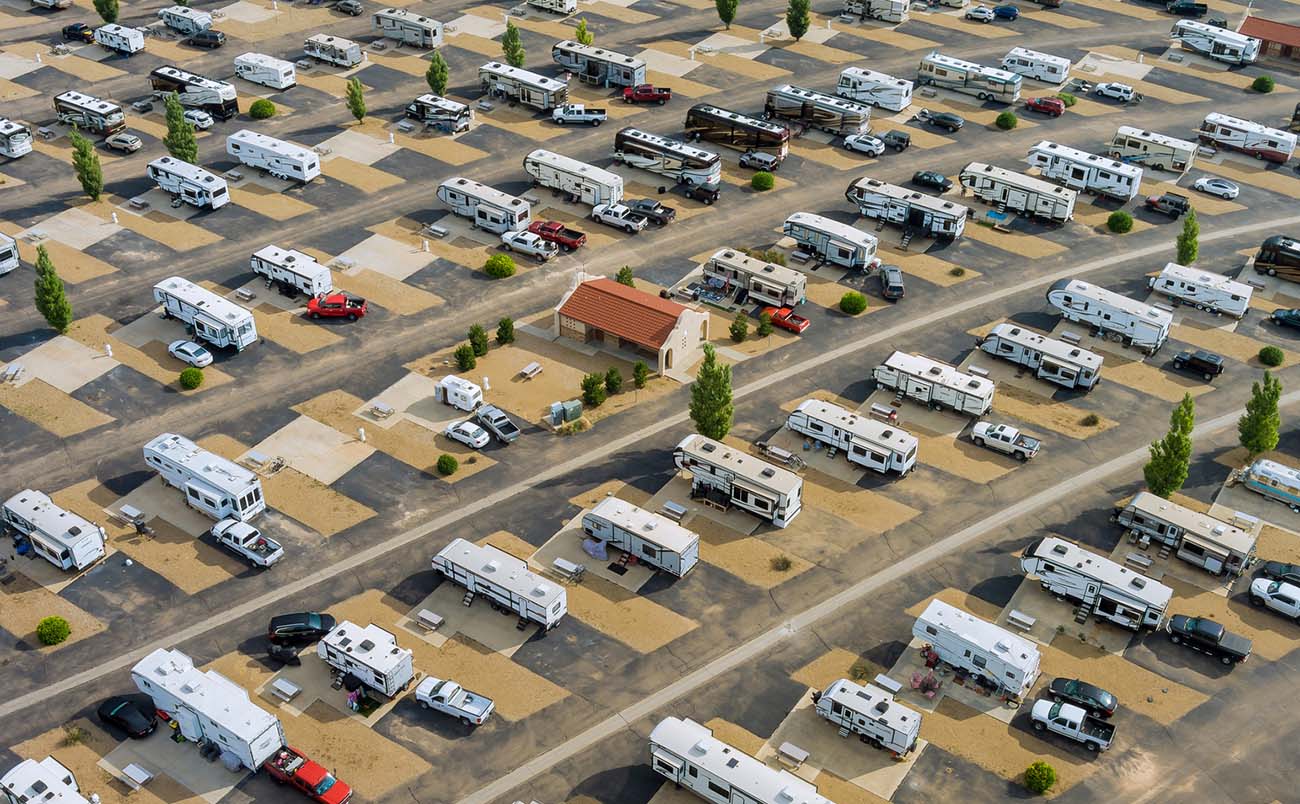 Aerial view of a recreational vehicle park with campers that have passed rv inspection services